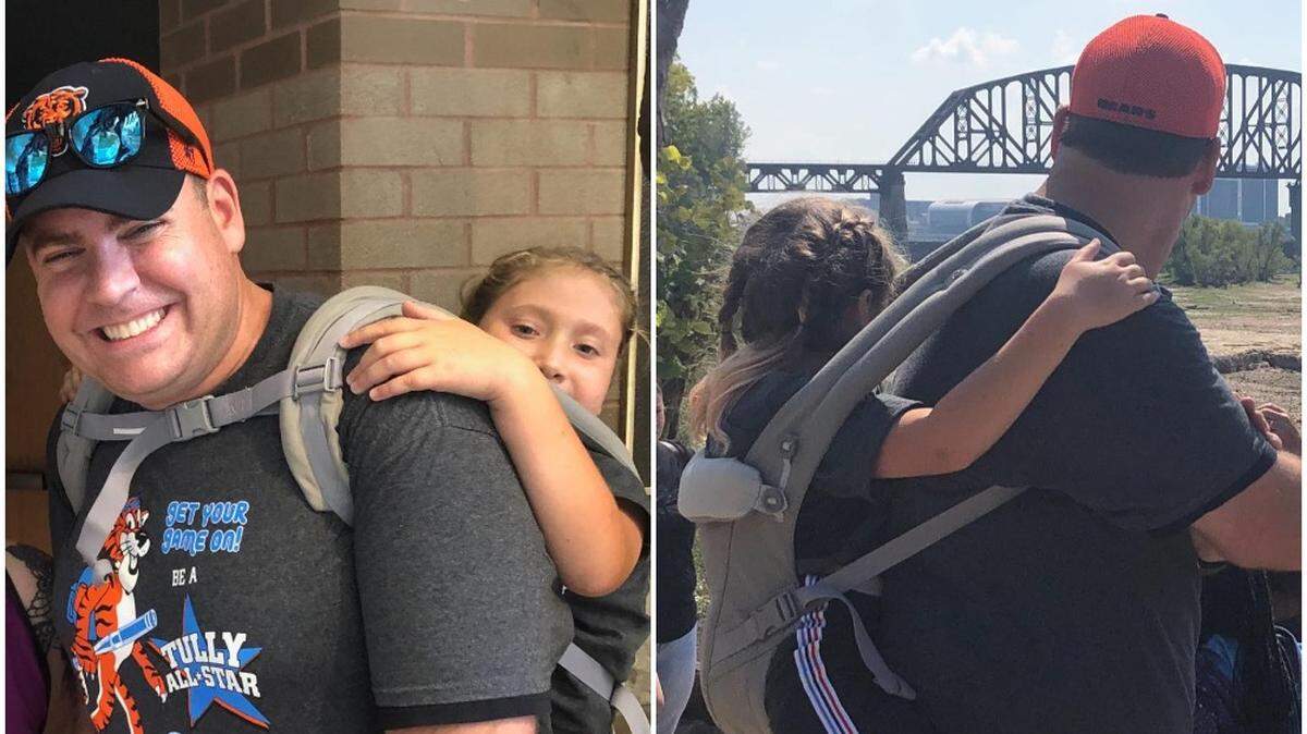 Jim Freeman, a teacher at Tully Elementary School in Louisville, carried a 10-year-old girl with spina bifida during a class hiking trip.