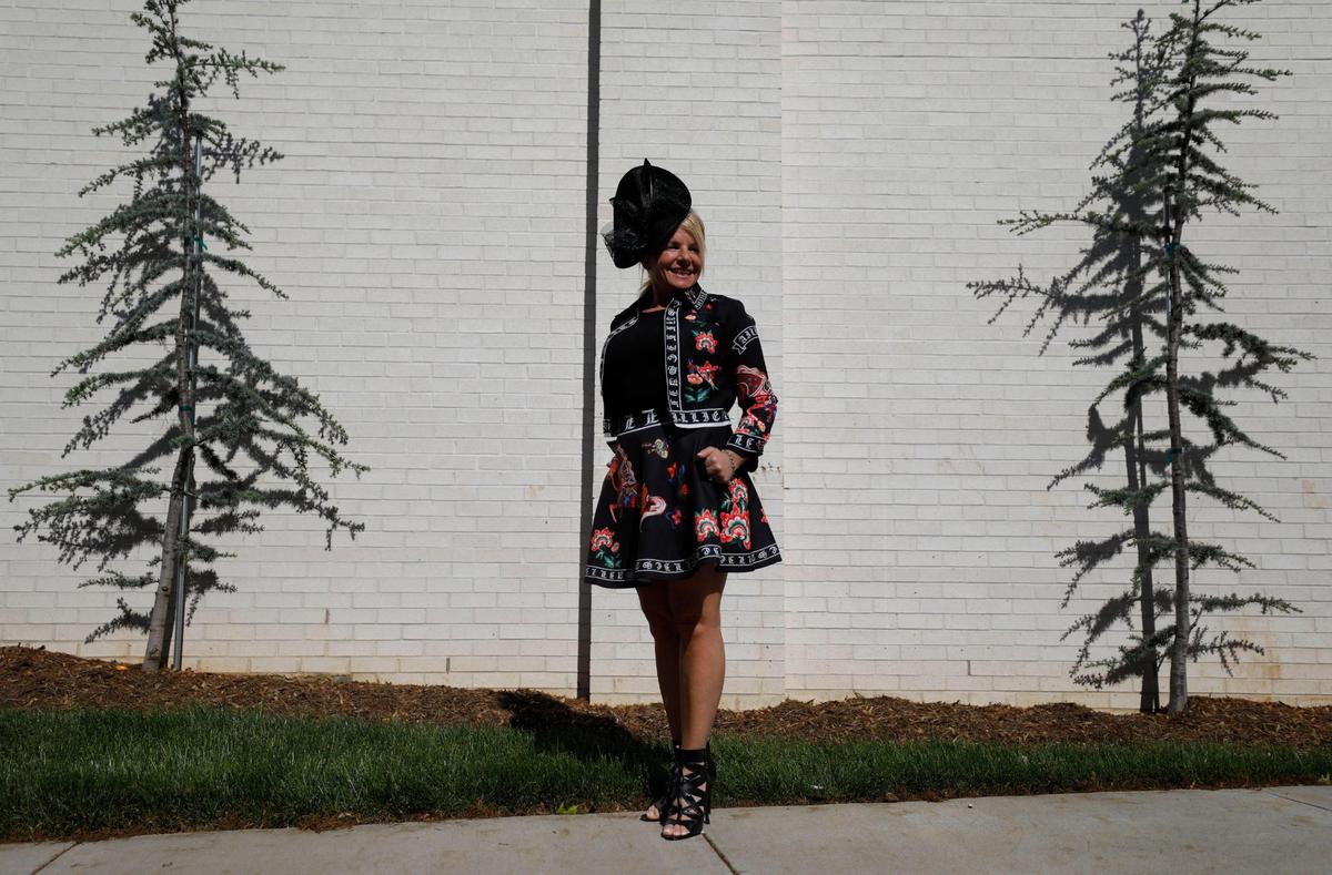 Andrea Ciccipurchased her dress, featuring a mini-shirt and a jacket, online and got her hat from Von Maur in Louisville to wear to the Kentuckky Derby at Churchill Downs in Louisville, Ky., Saturday, May 1, 2021.