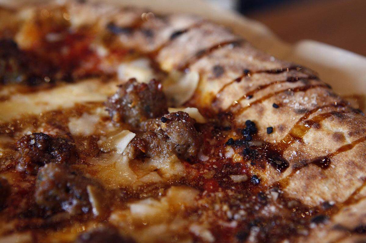 Crust, featured wood-fired pizza like the Dante arrabiata, sausage, fior di latte, garlic, parmesan and balsamic honey. After closing during the COVID pandemic, the local restaurant is making a comeback in 2025.