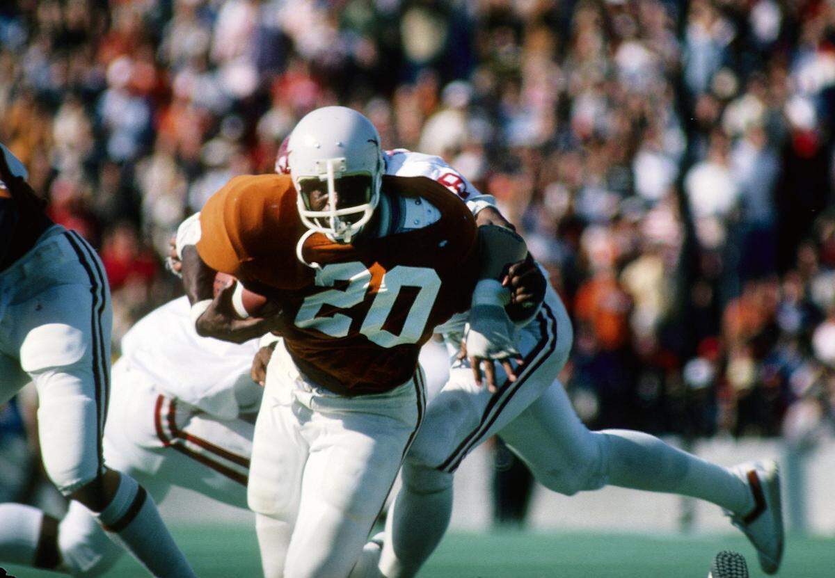 Over his four year Texas Longhorns career (1974 through 1977), running back Earl Campbell (20) ran for 4,443 yards and 40 touchdowns and won the 1977 Heisman Trophy.