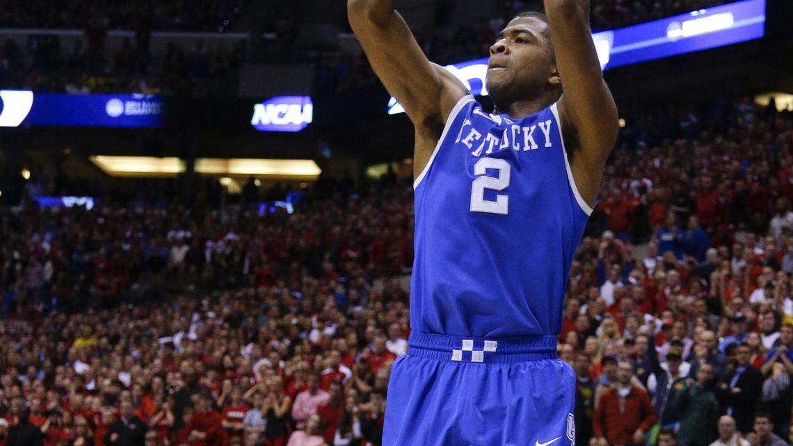 Kentucky Wildcats guard Aaron Harrison (2) hit a three pointer with 40 seconds left to give Kentucky the lead,  as Kentucky defeated Louisville 74-69 on Friday March 28, 2014 in  Indianapolis, IN. Photo by Mark Cornelison | Staff