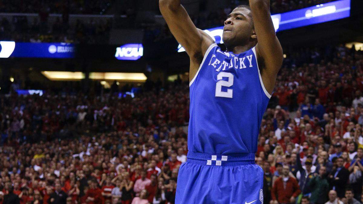 Kentucky Wildcats guard Aaron Harrison (2) hit a three pointer with 40 seconds left to give Kentucky the lead,  as Kentucky defeated Louisville 74-69 on Friday March 28, 2014 in  Indianapolis, IN. Photo by Mark Cornelison | Staff