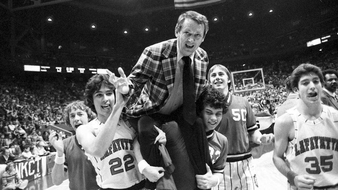 Jeff Parrett, left, and Brandt Ely gave Lafayette coach Jock Sutherland a boost on their shoulders after the Generals defeated Christian County 62-52 to win the Sweet Sixteen state basketball tournament in Rupp Arena on March 17, 1979.