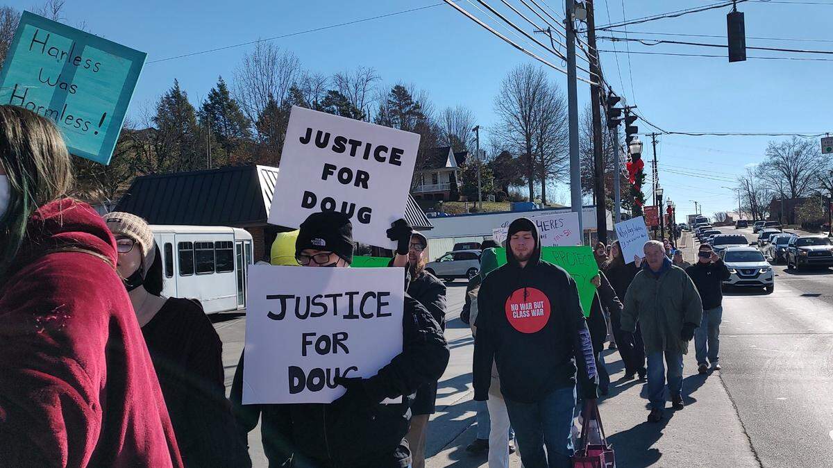 Protesters marched to a parking lot across from the London Police Department in Laurel County, Ky., Saturday, Jan. 4, 2025, to call attention to the death of Douglas Harless. Harless died after being shot at his home by police who apparently had intended to go to a different address nearby to execute a search warrant.
