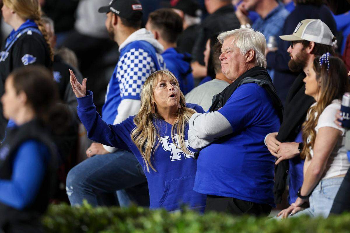 Kentucky fans react after a play against South Carolina during Saturday night’s game at Williams-Brice Stadium in Columbia, S.C.