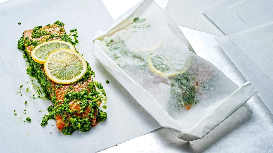 Whether you call it packet cooking or en papillote, the method of wrapping fish in parchment with a splash of liquid, some aromatics and vegetables makes for a no-fuss but elegant meal. MUST CREDIT: Photo by Scott Suchman for The Washington Post.