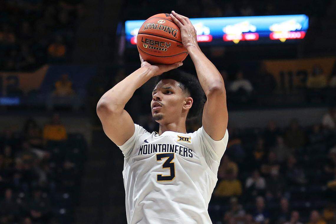 West Virginia forward Tre Mitchell (3) shoots against Navy during the second half of an NCAA college basketball game in Morgantown, W.Va., Wednesday, Dec. 7, 2022. (AP Photo/Kathleen Batten)