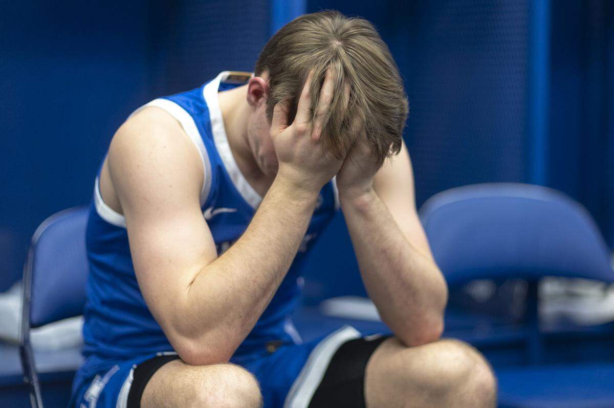 Kentucky guard Travis Perry reacts in the locker room following Friday’s loss to Tennessee in the Sweet 16 at Lucas Oil Stadium in Indianapolis.