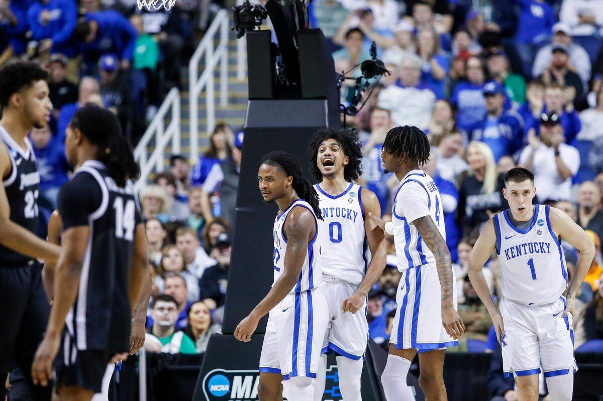 Kentucky forward Jacob Toppin (0) celebrates drawing a charge against Providence forward Bryce Hopkins during an NCAA Tournament first-round game at Greensboro Coliseum in Greensboro, N.C., on Friday.