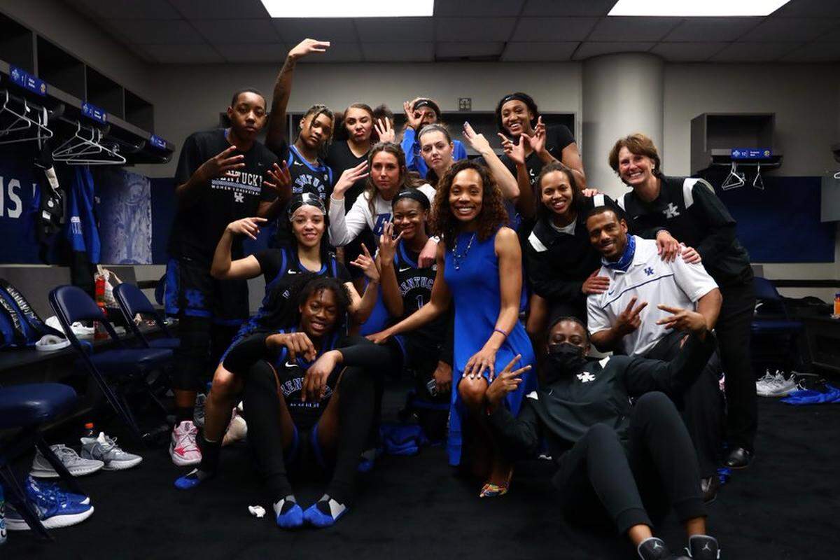 The Kentucky women’s basketball team poses for a photo after defeating Tennessee in the SEC Tournament semifinals on Saturday night at Bridgestone Arena in Nashville.