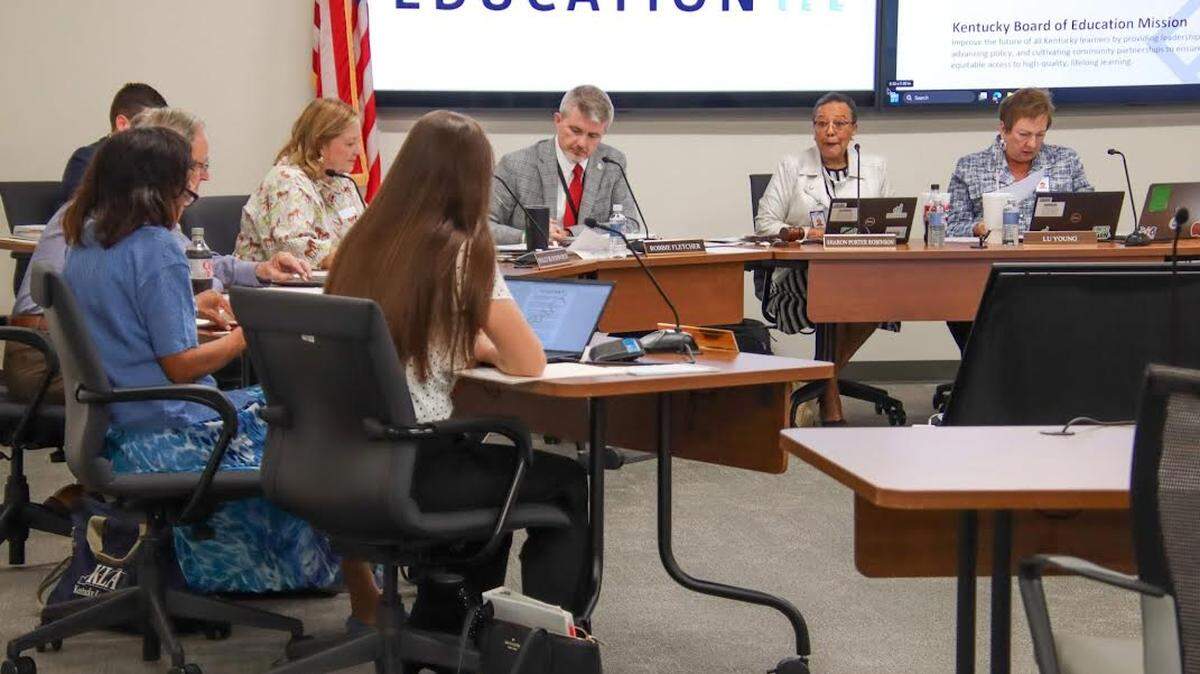 Kentucky Education Commissioner Robbie Fletcher, wearing a red tie, attends a Kentucky Board of Education meeting in this file photo. Fletcher announced Wednesday the state has secured a contract for all high school juniors to take the SAT at no cost.