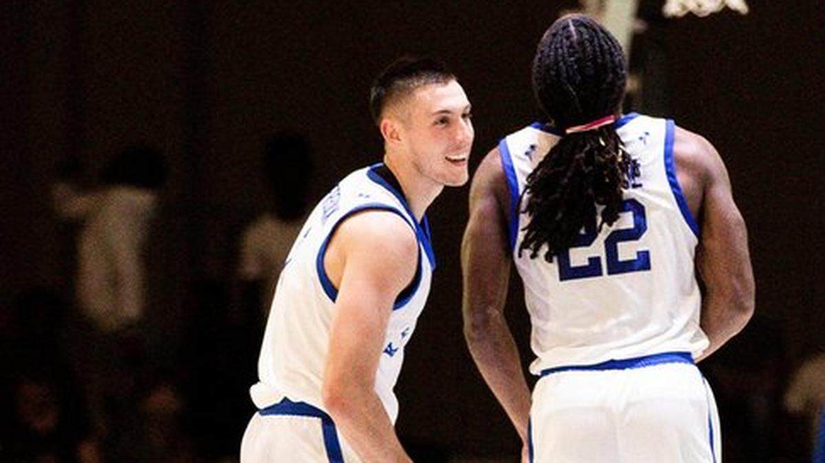 CJ Fredrick and Cason Wallace celebrate after a made basket in Kentucky’s exhibition game against Carleton University in Nassau, Bahamas, on Saturday, Aug. 13, 2022.