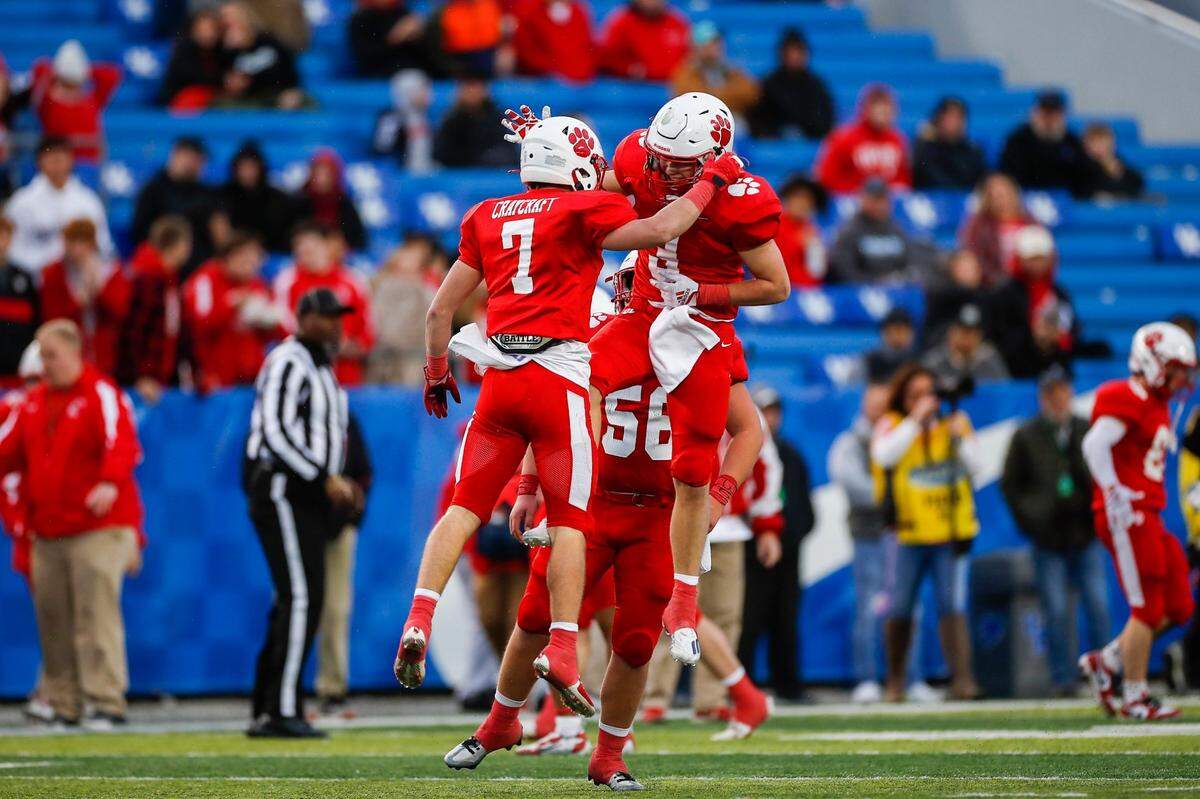 Beechwood’s Carson Craycraft (7) celebrates with teammate Bomani Hughes (4) after intercepting a pass during Friday’s win over Mayfield.