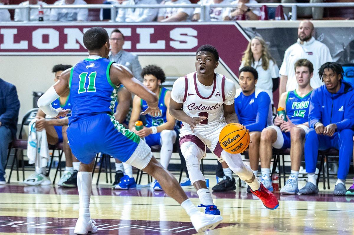 Eastern Kentucky guard Leland Walker (2) looks to shoot the ball as Florida Gulf Coast guard Isaiah Thompson (11) defends at Baptist Health Arena in Richmond on Feb. 7.