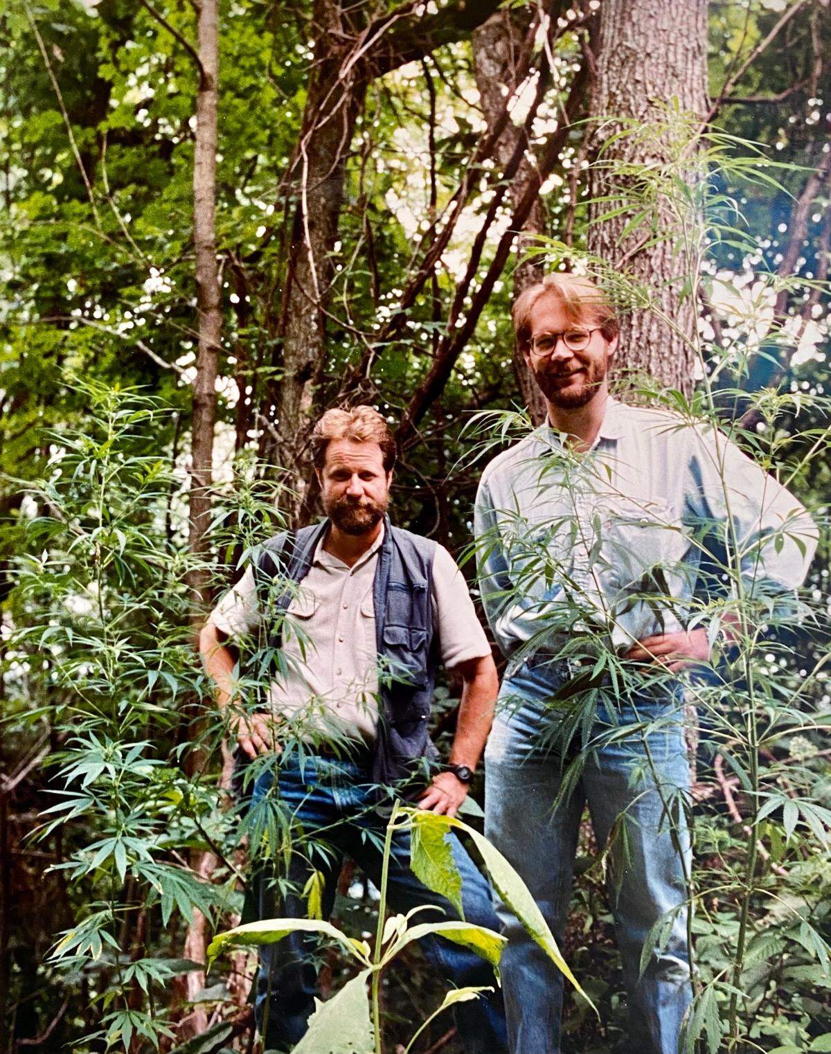 Former Herald-Leader photographer Ron Garrison, left, and longtime reporter Bill Estep were photographed while covering marijuana eradication in Eastern Kentucky in 1992.