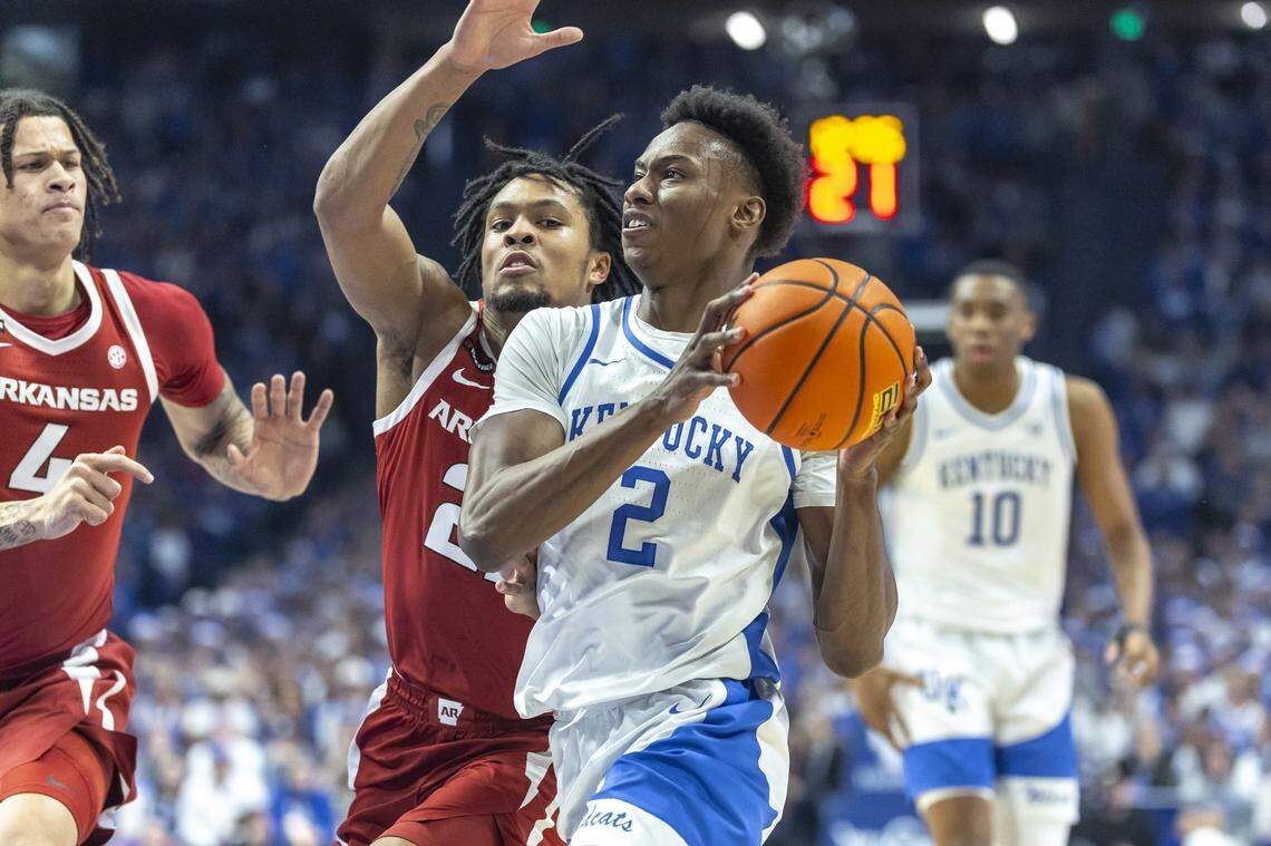 Kentucky’s Jaxson Robinson (2) drives against Arkansas’ D.J. Wagner (21) during Saturday’s game in Rupp Arena.