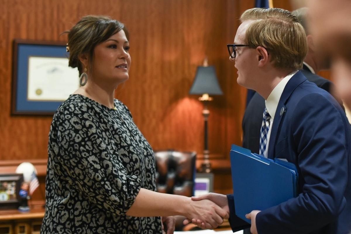 Lieutenant Governor Jacqueline Coleman shakes Nicholas Hazelett’s hand at a 2023 meeting. Hazelett helped represent Paintsville Independent School District at a meeting regarding grant funds.