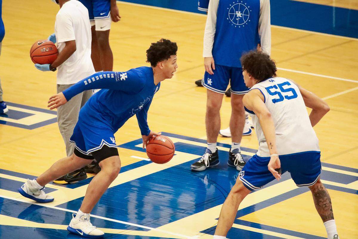 Zan Payne, left, worked against freshman forward Lance Ware (55) during a recent practice.