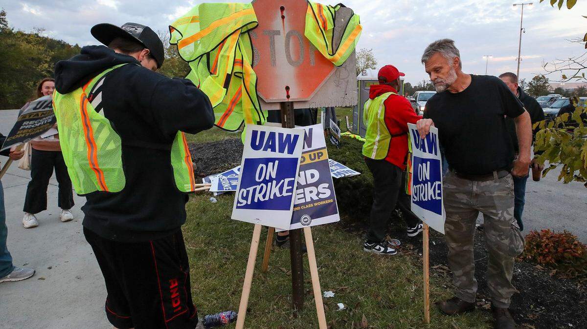 Workers hang their safety vests on a shipping and receiving sign as they change shifts on the picket line. UAW local 862 members strike outside of Ford's Kentucky Truck Plant in Louisville, Kentucky, on Thursday, October 12, 2023