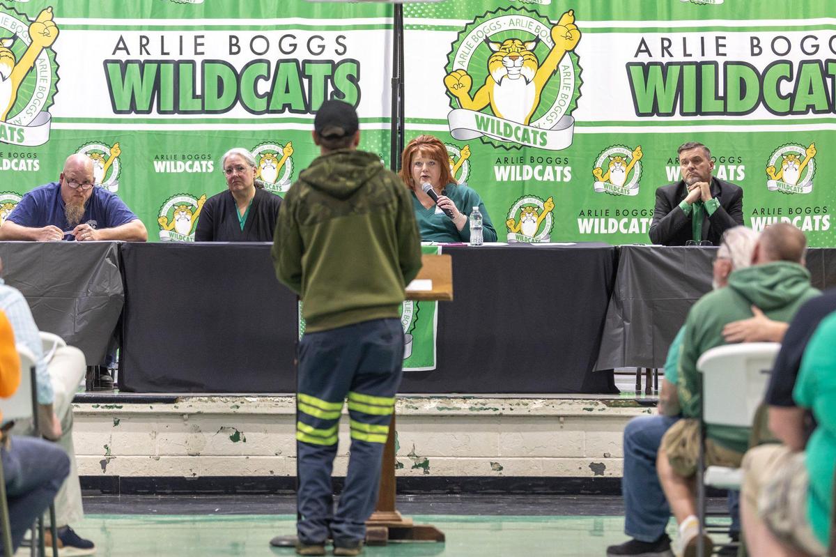 Denise Yonts, with microphone, Letcher County Schools superintendent, responds to a community member during an open meeting at Arlie Boggs Elementary School in Eolia, Ky., on Thursday, April 17, 2025. The school has faced declining enrollment.