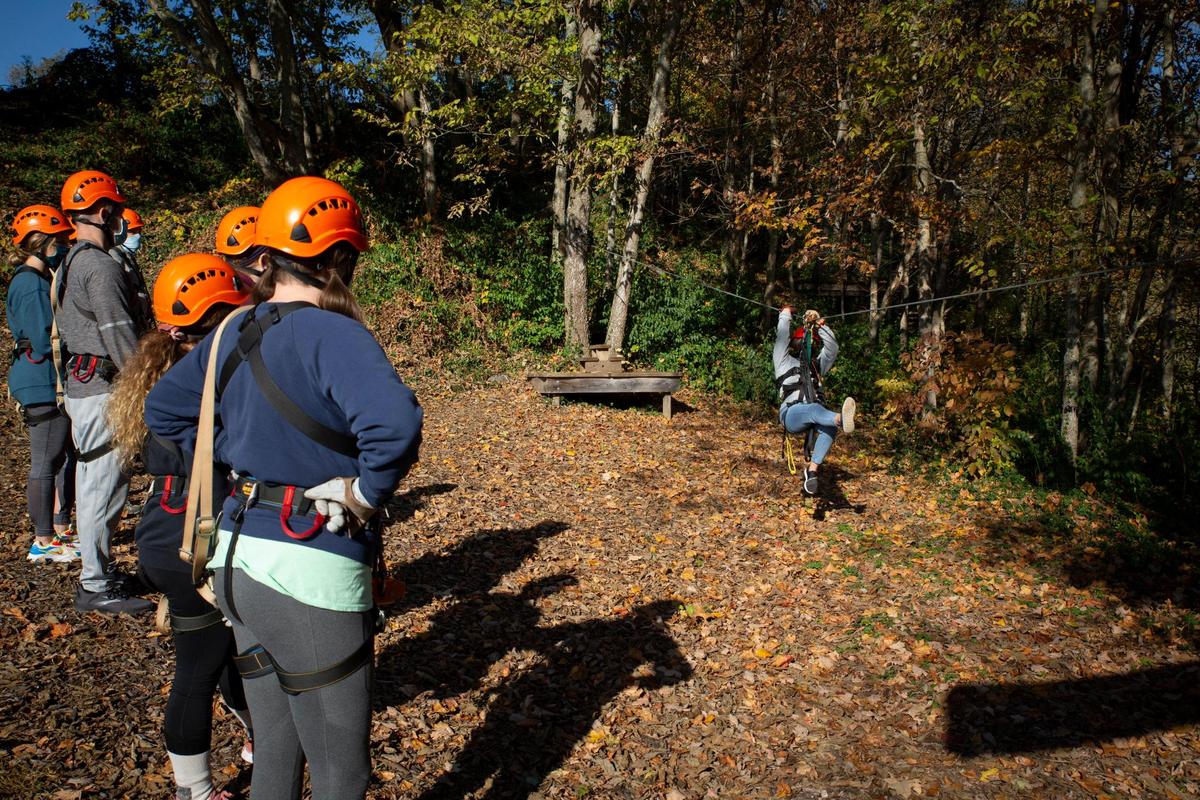 Jada McKenzie, a guide at Boone Creek Outdoors, demonstrates the basics of zip lining during “ground school” to participants in the Boone Creek Outdoors Zip Line Canopy Tour on Saturday, Oct. 17, 2020, in Lexington, Ky. The Canopy Tour includes six zip lines, three sky bridges, a rappel, a spiral, and a floating staircase.