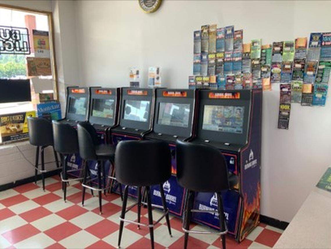 A row of unregulated gambling machines sits in the front of a Frankfort convenience store, right below a wall of winning scratch-off tickets from the Kentucky Lottery.