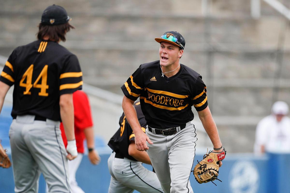 Woodford County’s Bryce Patterson celebrates closing an inning against Russell County during the state baseball semifinals at Kentucky Proud Park.