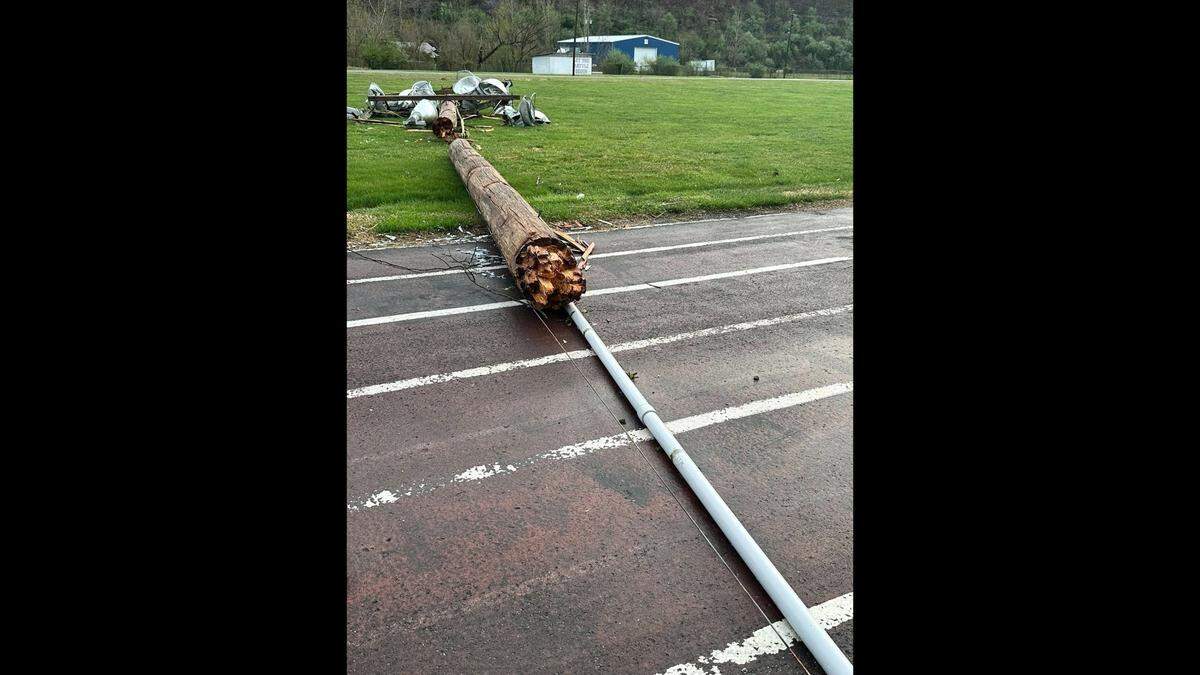A utility pole fell on the track at Allen Central High School after a strong thunderstorm swept through the area on March 30, 2025.