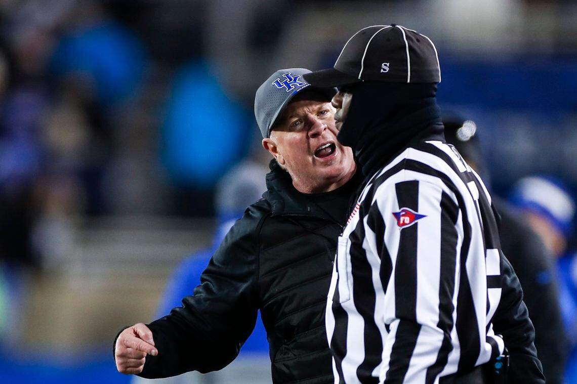 Mark Stoops yells at a referee after a call against his team during the second half of Saturday’s loss to No. 1 Georgia at Kroger Field.