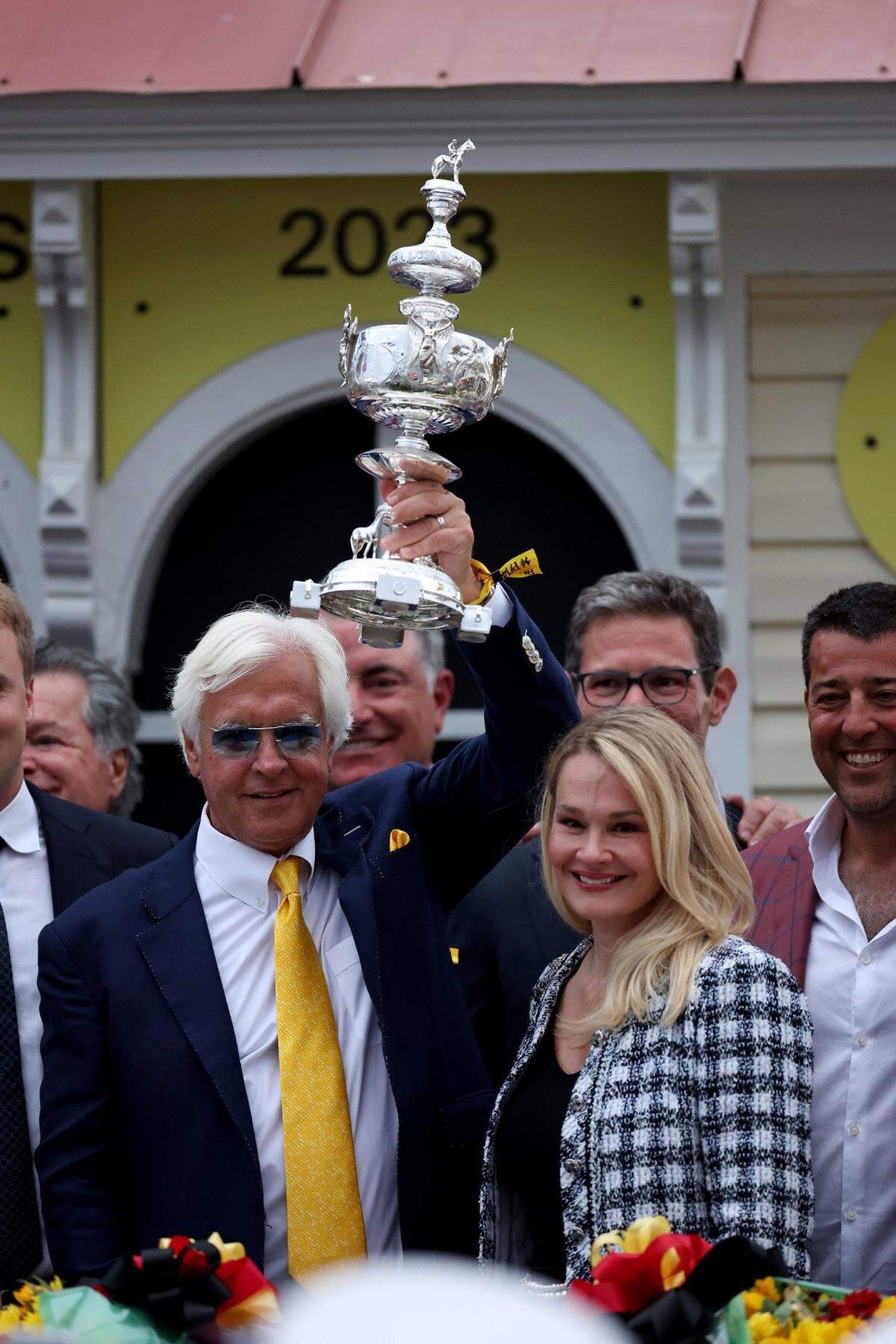 Trainer Bob Baffert celebrates in the winner's circle after his horse, National Treasure, won the 148th Preakness Stakes in Baltimore last year. For the third straight year, Baffert will not be allowed to race horses in the Kentucky Derby. The difference this year, though, is the Hall of Famer will not hand off his top horses to a fellow trainer to run in his absence.