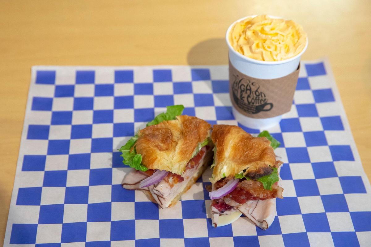 The Crangerine Turkey Club includes turkey, bacon, provolone, lettuce, tomato, onion, house-made cranberry and tangerine sauce with roasted garlic mayonnaise on a croissant at High on Art & Coffee at 523 East High St. in Lexington, Ky. Thursday, Oct. 21, 2021