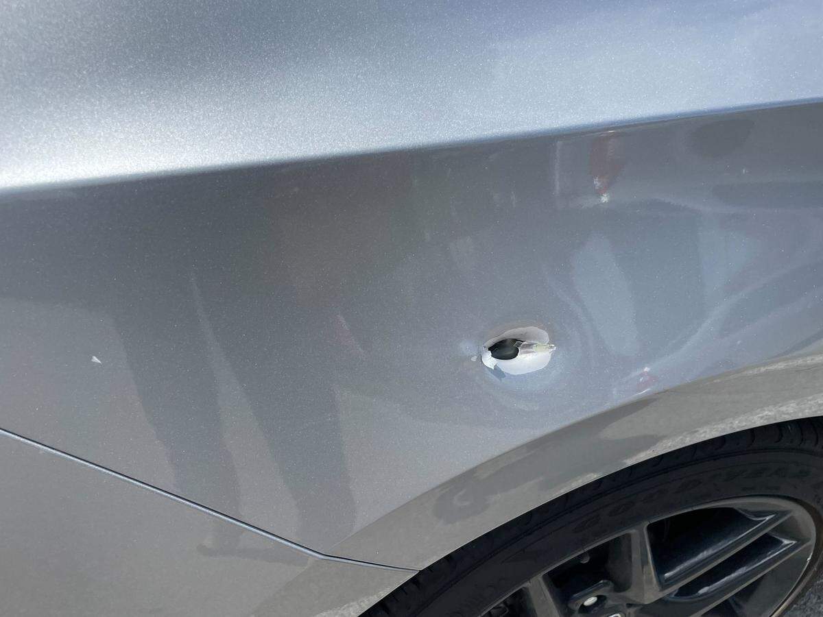 A bullet hole was spotted on a bystander’s vehicle at the scene of a shooting at the Hardin County Justice Center in Elizabethtown, Ky. on Aug. 19, 2024.