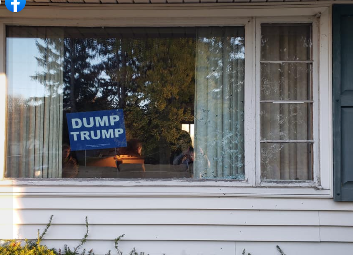 One of the suspects shot at the house, and damage to the lower right corner of the window shows where the projectiles hit. The homeowner told police the suspect was aiming for the “Dump Trump” sign displayed in the window.