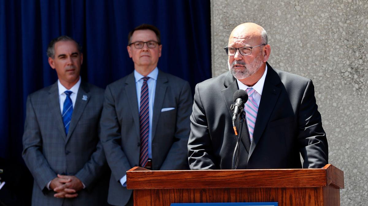 Craig Turner, Chairman of the Lexington Center Board of Directors, spoke during a groundbreaking ceremony held in front of Heritage Hall Thursday afternoon for the Lexington Convention Center Expansion. This highly-anticipated $241 million dollar construction project is slated to begin in August 2018 and be completed in November 2021. The 3-year project will be built in phases to allow Rupp Arena and much of the existing convention center to remain in operation during construction. In the background was University of Kentucky Finance and Administration Executive Vice President Eric Monday, left, and Lexington Mayor Jim Gray, middle.