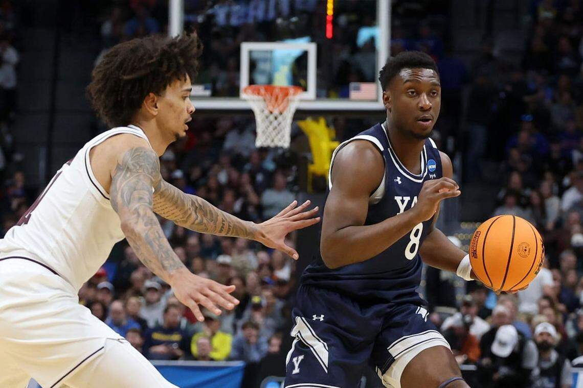 DENVER, COLORADO - MARCH 20: Isaac Celiscar #8 of the Yale Bulldogs drives against Andersson Garcia #11 of the Texas A&M Aggies during the first half in the first round of the NCAA Men's Basketball Tournament at Ball Arena on March 20, 2025 in Denver, Colorado. (Photo by Matthew Stockman/Getty Images)