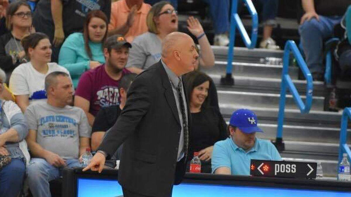 Floyd Central boys’ basketball coach Kevin Spurlock, center, has resigned from that position.