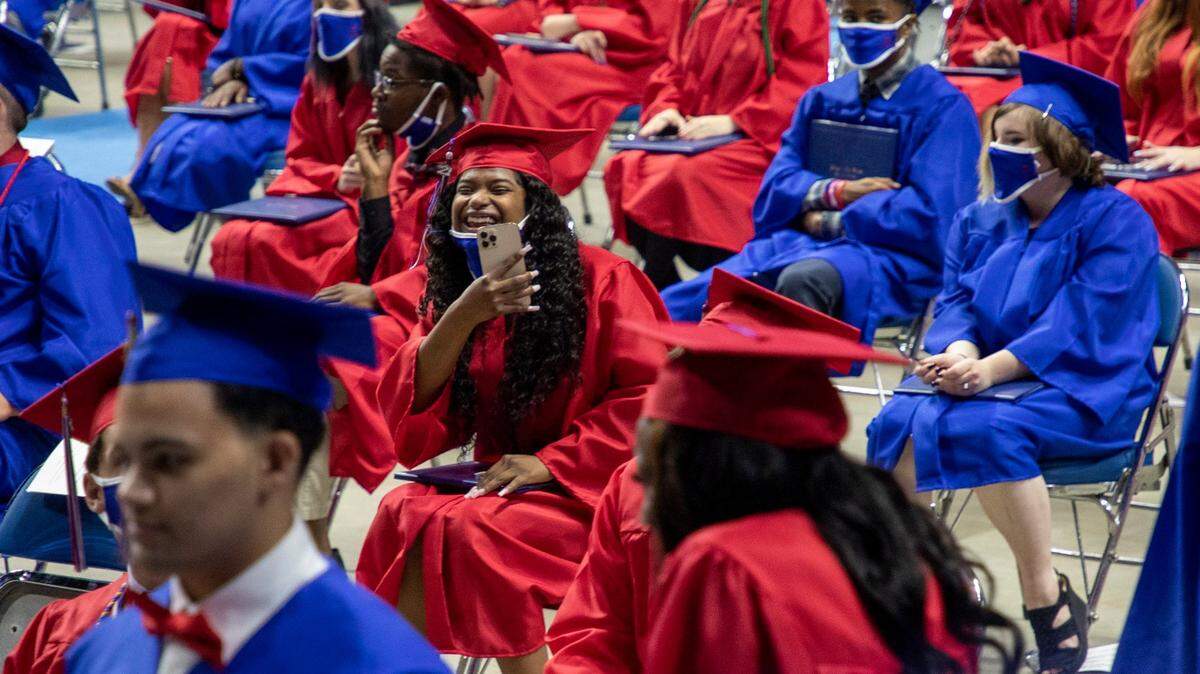 Lafayette High School had some of the highest scores on 2021 statewide achievement tests, according to results released Wednesday. In this file photo, graduate Rahanna Bibbs took a picture of a friend during graduation at Rupp Arena in May.