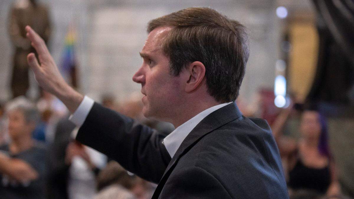 Kentucky Gov. Andy Beshear greets attendees at the Fairness Rally at the Kentucky state Capitol in Frankfort, Ky., on Wednesday, Feb. 15, 2023.
