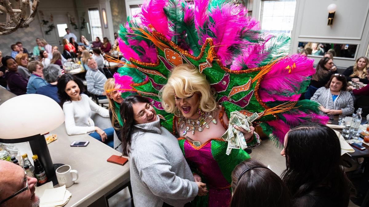 Drag queen Tyese Rainz hugs an audience member during the ÒDouble D BrunchÓ drag brunch event on Sunday, Jan. 19, 2020, at Epping’s on Eastside in Lexington, Kentucky.