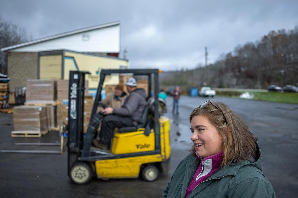 Nicky Stacy, founder of Hazel Green Food Project, works with volunteers to prepare to distribute food and other items in Hazel Green, Ky., on Friday, Nov. 22, 2024.