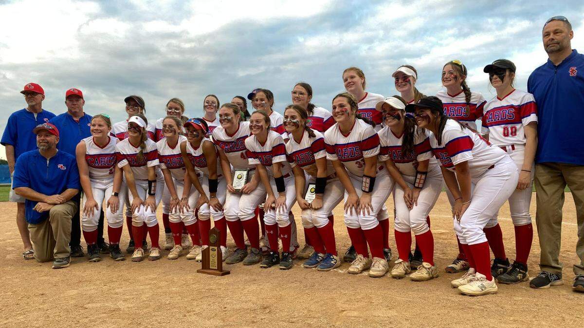 Scott County’s softball team celebrates its defeat of Bryan Station on Thursday. The Cardinals are undefeated in the 42nd District Tournament since joining the 11th Region in 2006.