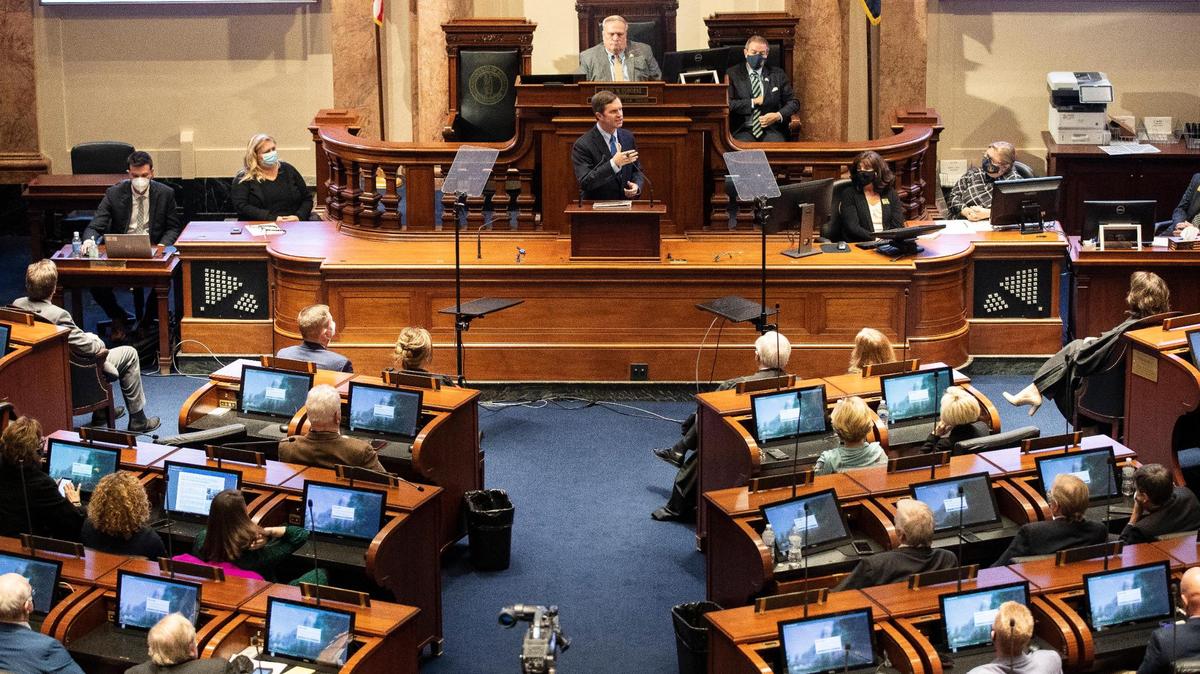 Gov. Andy Beshear gives a State of the Commonwealth address from the House of Representatives at the Capitol in Frankfort, Ky., Wednesday, January 5, 2022.
