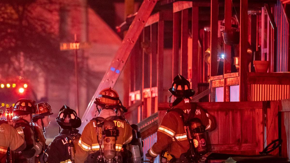 Members of the Lexington Fire Department respond to a structure fire on West Seventh Street in Lexington, Ky., on Thursday, Dec. 28, 2022.