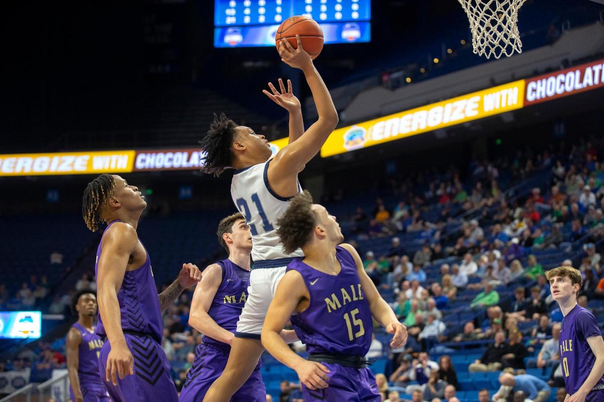 Warren Central’s Chappelle Whitney (21) drives through Male defenders during the Dragons’ first-round win at the Sweet 16 on Thursday. Whitney finished with 14 points and six rebounds.