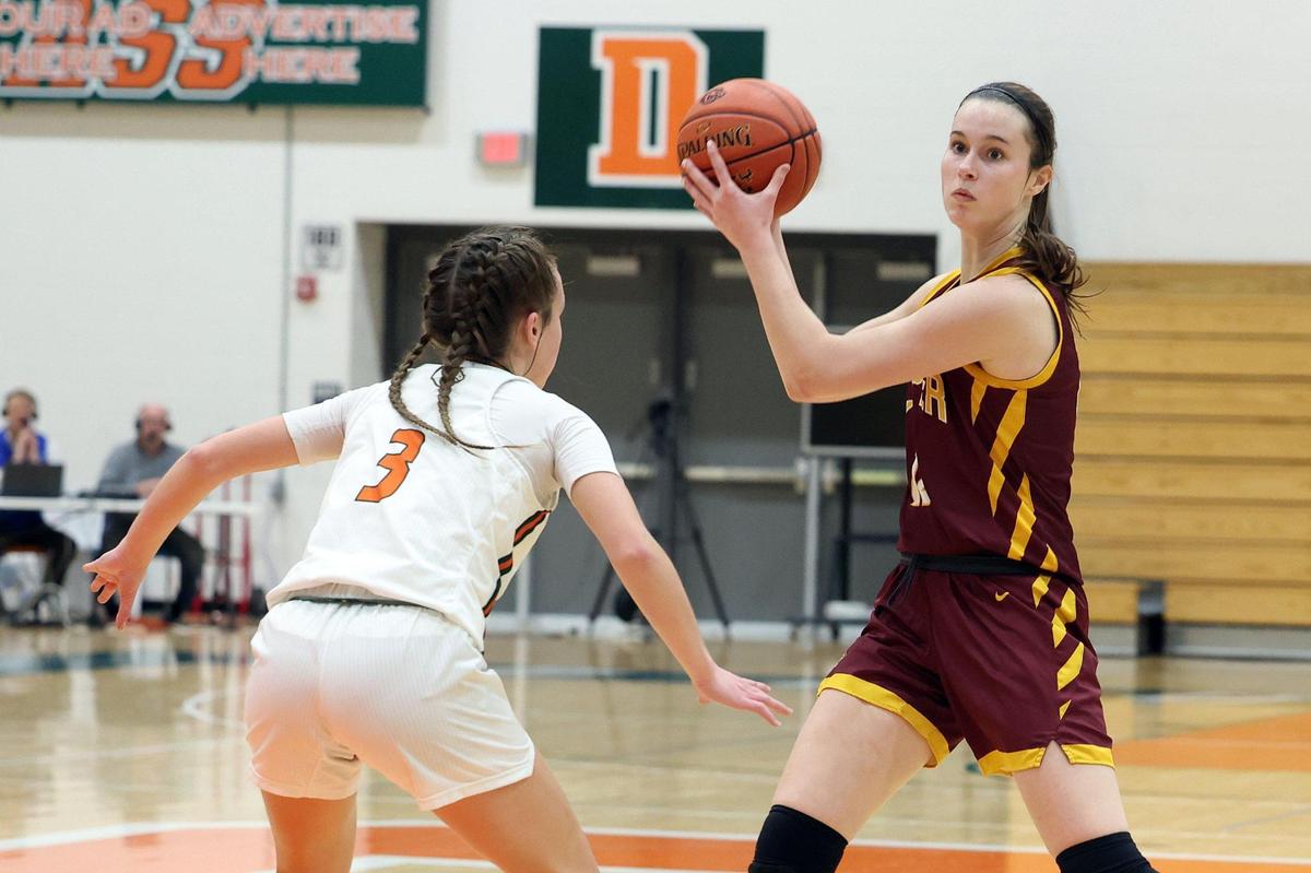 Cooper’s Whitney Lind, right, is defended by Frederick Douglass’ Niyaune Gentry during Friday’s game in Lexington. Cooper won 68-56.