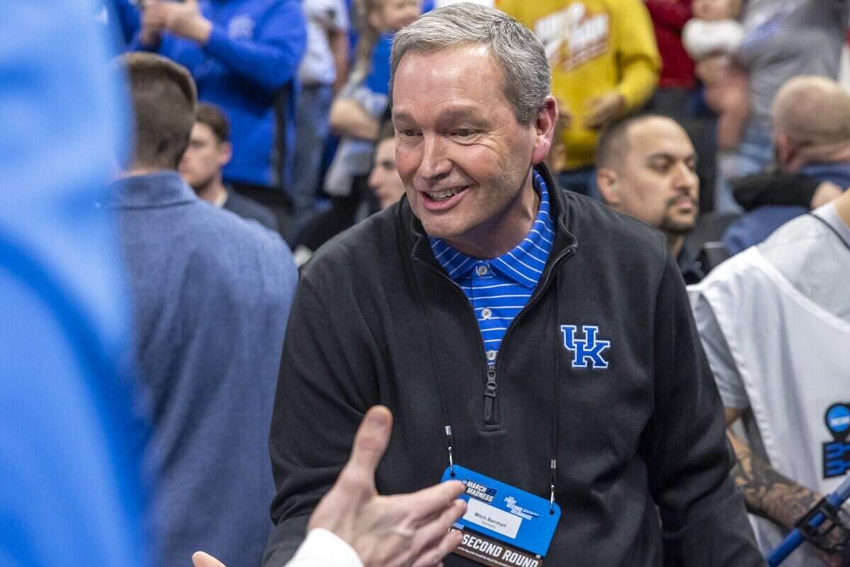 Kentucky athletics director Mitch Barnhart greets UK players following the Wildcats’ 84-75 win over Illinois in the 2025 NCAA men’s basketball tournament round of 32.