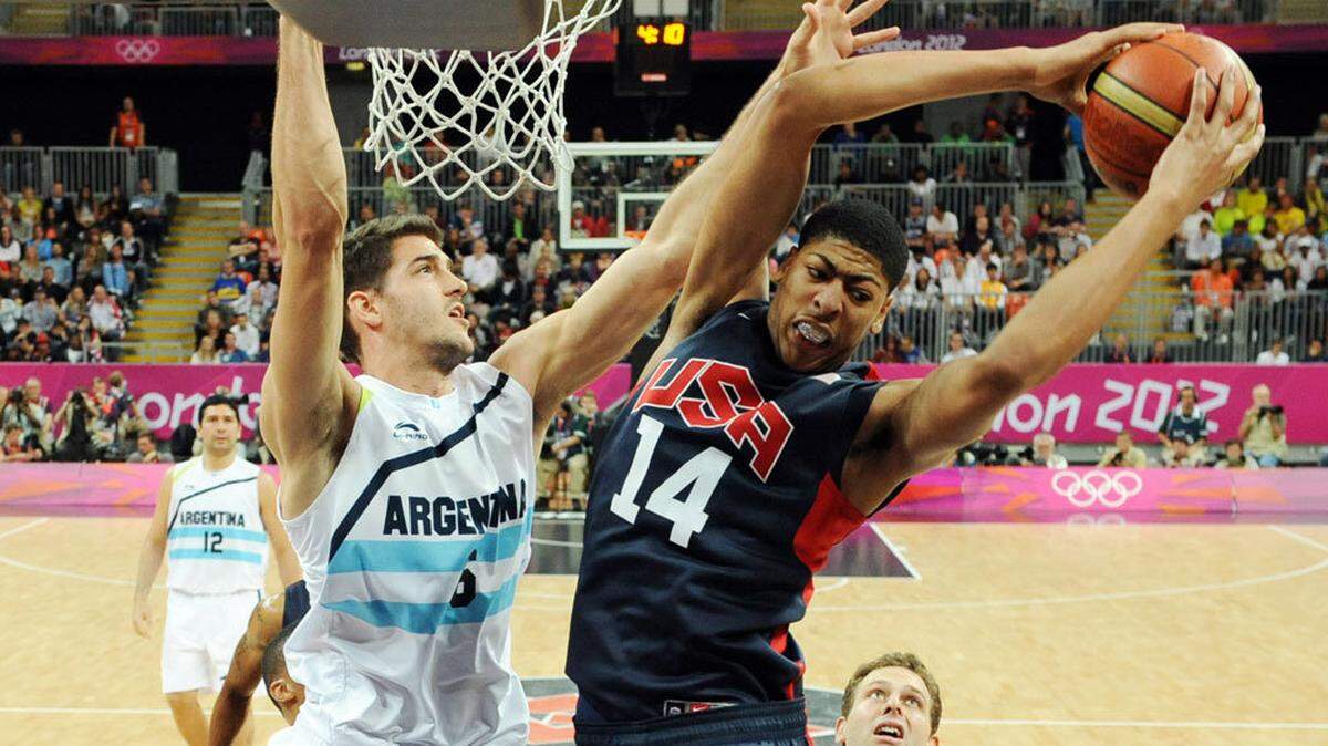 Former University of Kentucky center Anthony Davis, right, battled for a rebound with Argentina's Marcos Mata during the fourth quarter of Team USA's 126-97 victory in their final game of group play. Davis had two points, three rebounds and two blocked shots.
