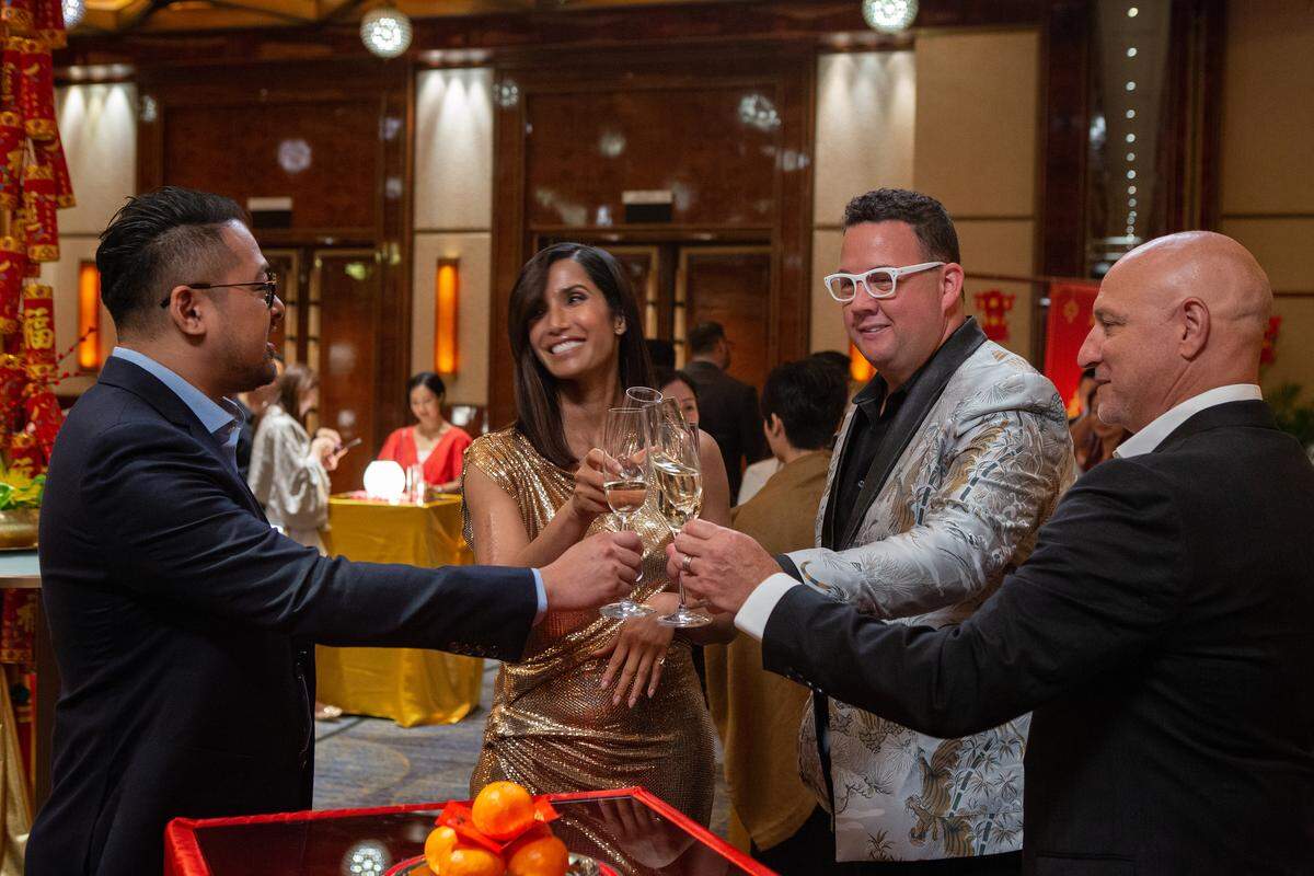 Getting the party started in Macau: Guest judge chef Jowett Yu, host Padma Lakshmi, judge Graham Elliot and head judge Tom Colicchio toast.