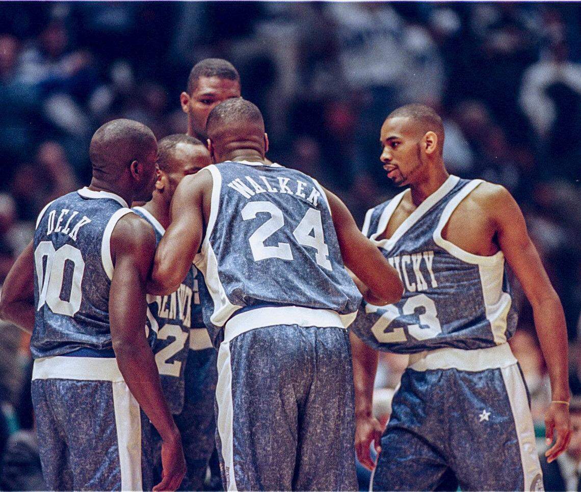 Kentucky basketball player Antoine Walker (24) pulls his teammates together for a huddle during an NCAA Tournament Final Four game against UMass on March 30, 1996, in East Rutherford, New Jersey. UK went 34-2 during the 1995-96 season on its way to the NCAA title.