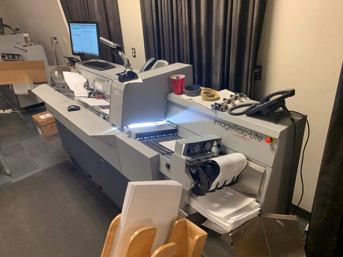 This photo depicts records being scanned. Four of these high-speed scanners operate through two, eight-hour shifts, Monday through Friday, and are capable of scanning up to 400,000 scans per day.